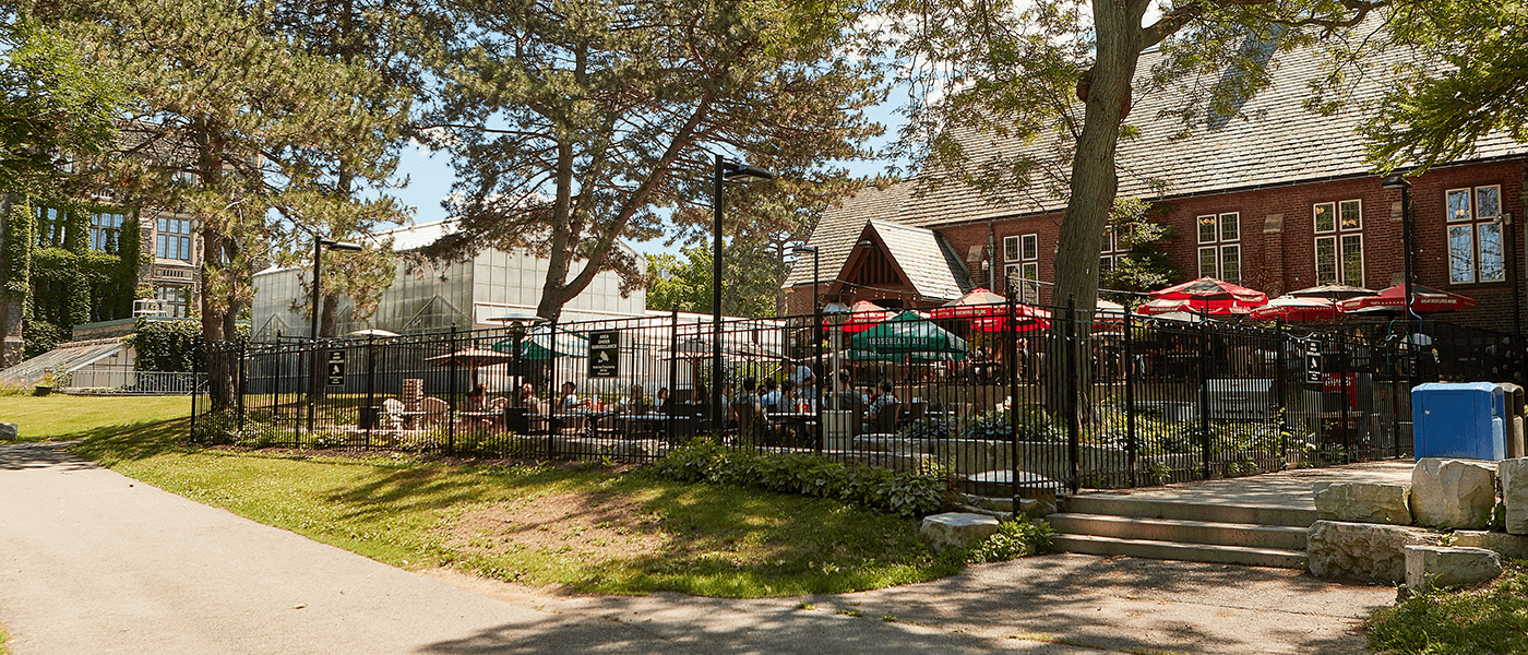 Restaurant and patio with umbrellas at McMaster University in Hamilton